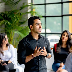 marketing guide professional latino person speaking in front of groups-1 marketing guide professional latino person speaking in front of groups-1